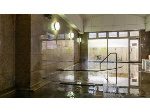 an empty room with water on the floor at Hotel Symphony - Vacation STAY 48767v in Sagae +38 photos