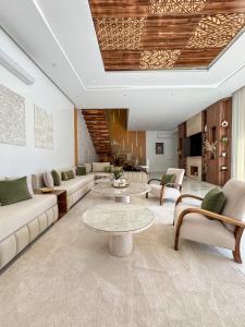 a living room with a couch and a table at Villa Ramona in Marrakech