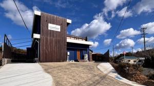 a building with a sign on the side of it at oceanhouse iseshima - Vacation STAY 67855v in Kō +9 photos