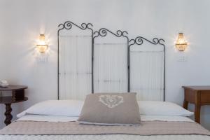 A bed or beds in a room at B&B Airone Cervia - Camere e Appartamenti