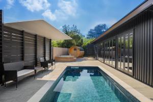 a swimming pool in the backyard of a house at Grand Resort Shirahama - Vacation STAY 72313v in Hongō