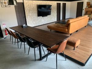 a dining room table with a chair and a couch at Grand Resort Shirahama - Vacation STAY 72313v in Hongō