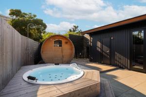 a jacuzzi tub on a deck with a house at Grand Resort Shirahama - Vacation STAY 72313v in Hongō