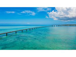 a long pier in the middle of the water at Smile Hotel Miyakojima - Vacation STAY 93495v in Miyako Island +14 photos