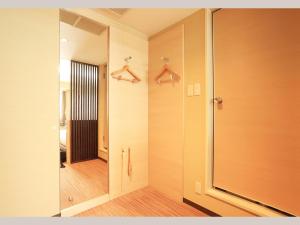 a bathroom with a walk in shower and a mirror at Smile Hotel Otsu Seta - Vacation STAY 00125v in Zeze-Awazumachi +25 photos