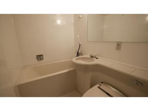 a bathroom with a sink and a tub and a toilet at Smile Hotel Otsu Seta - Vacation STAY 00151v in Zeze-Awazumachi +20 photos