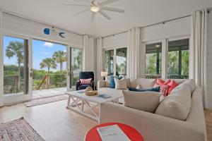a living room with a couch and a table at 19 Eugenia Avenue by Akers Ellis Rentals in Kiawah Island