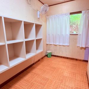 a room with white shelves and a window at Minpaku Gozamisaki - Vacation STAY 23480v in Goza +24 photos