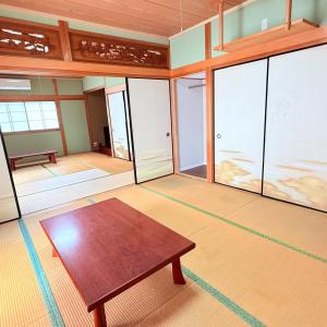 a room with a table and some glass doors at Minpaku Gozamisaki - Vacation STAY 51924v in Goza