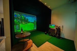 a room with a video game on a large screen at Star-Seven Itoshima - Vacation STAY 20184 in Keya