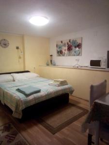 Ένα ή περισσότερα κρεβάτια σε δωμάτιο στο Apartman Tihana