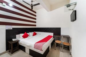 a bedroom with a bed with a flag painted on the wall at Hotel O Landlord in Rohtak