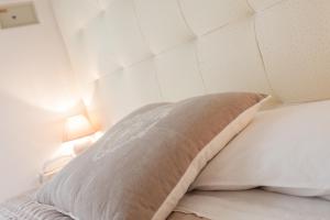A bed or beds in a room at B&B Airone Cervia - Camere e Appartamenti