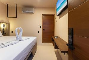 โทรทัศน์และ/หรือระบบความบันเทิงของ Hotel Pakal 58 Centro +14 ภาพ