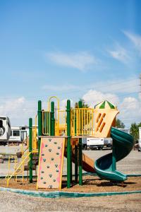 a playground with a slide and a slideintend at JW Grand Junction in Grand Junction
