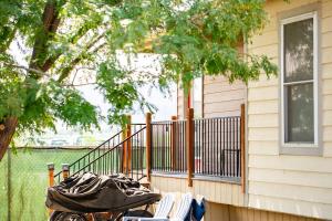 a porch of a house with a bunch of chairs at JW Grand Junction in Grand Junction