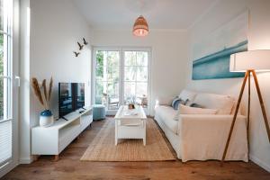 Μια τηλεόραση ή/και κέντρο ψυχαγωγίας στο Ferienhaus Strandgold