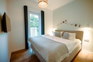 Ένα ή περισσότερα κρεβάτια σε δωμάτιο στο Ferienhaus Strandgold