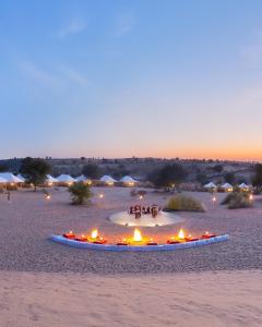 a circle of fire in the desert at night at Venture Desert Camp Jaisalmer in Jaisalmer