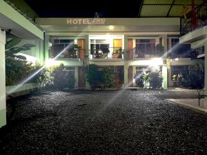 a hotel at night with a street in front of it at Hotel FAS in Fortuna
