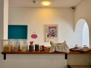 a shelf with food items on it in a kitchen at Vecinos by La Palmera in Bogotá