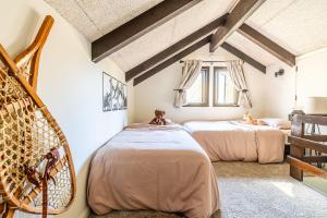 a bedroom with two beds in a attic at Beech Mountain Escape with Views in Beech Mountain
