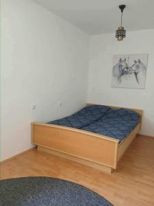 a bedroom with a bed with a blue mattress at Mujagin Han in Srebrenica