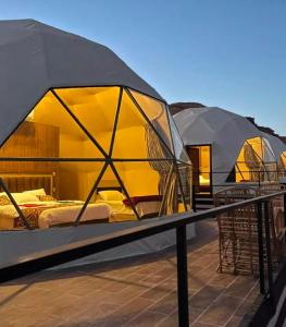 a group of tents on top of a roof at Wadi Rum Marsan in Wadi Rum