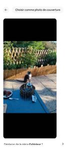 a picture of a person sitting at a table at Chambre d hôtes 'chalet du val' in Puessans +3 photos