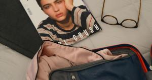 a picture of a woman sitting in a suitcase at Atmosfere 19 in Sant'Egidio del Monte Albino