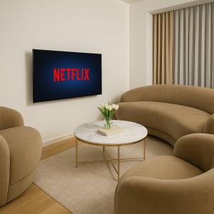 a living room with two couches and a tv at Lux Line Apartment in Zürich