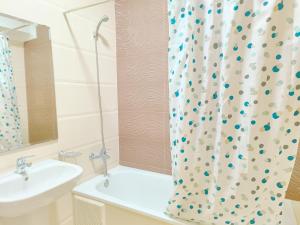 a bathroom with a sink and a shower curtain at Golden Holiday Family Only in Tangier +54 photos