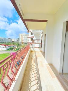 a balcony with chairs and a view of the city at Appartements Rihana Family Only in Tangier