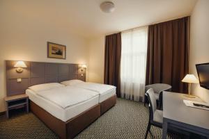 Posteľ alebo postele v izbe v ubytovaní Central Hotel Prague