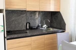 Kuchyň nebo kuchyňský kout v ubytování Mandi Apartament + 59 fotografií
