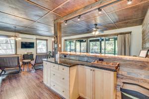 a kitchen with a large island in a house at Waterside Anglers Heaven Crooked River Fish Camp in Yankeetown