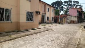 an empty street in a town with buildings at Apartamento COP 30 in Belém
