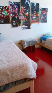 a bedroom with posters on the wall and a bed at Casa hospedaje Palomino in Abancay