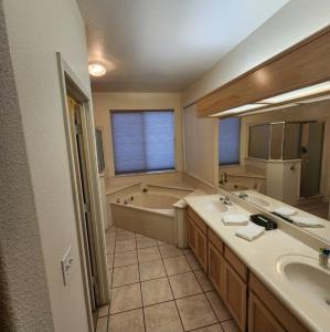 a bathroom with two sinks and a bath tub at The Gathering Spot-6 miles from Sequoia Nlt'l Park in Three Rivers