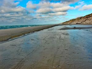 a view of a sandy beach with the ocean at Luxury Spa Retreat by Golf - By Traum Ferienwohnungen in Bunken