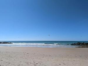 a sandy beach with the ocean in the background at 6 person holiday home in Hjørring-By Traum in Vester Vidstrup