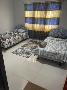 Ένα ή περισσότερα κρεβάτια σε δωμάτιο στο Urban Oasis