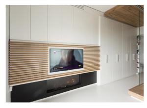 a living room with a tv and a fireplace at B&B Portorosso in Monopoli