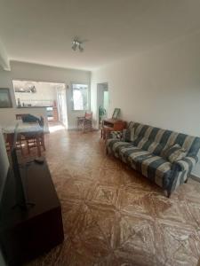 a living room with a couch and a table at Playa 81 in Necochea