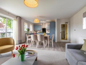a living room with a couch and a table at 2 Bed in St. Mellion 87710 in St Mellion