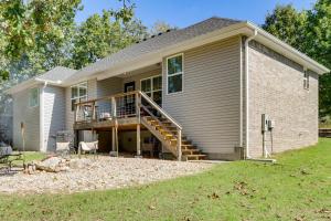 a house with a staircase leading to the front of it at Table Rock Lake Retreat Walk to Shore! in Eureka Springs