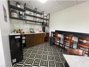 a restaurant with a bar with chairs and a counter at luz y vida  +3 photos