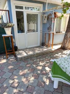 a front door of a house with a patio at Koru Pansiyon in Gelibolu