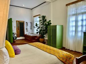 Ένα ή περισσότερα κρεβάτια σε δωμάτιο στο The Apsara