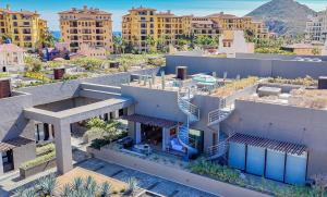 an aerial view of a building with buildings at Nauti Baja Condo at The Marina Near the Beach in Cabo San Lucas